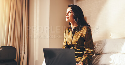 Buy stock photo Woman, thinking and laptop in hotel room for business trip, contemplation and planning for itinerary. Mature person, reflection and online in accommodation with computer, travel or calendar for work.