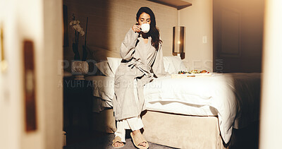 Buy stock photo Woman, relax and drink coffee on hotel bed with breakfast, weekend vacation and comfortable in robe. Mature person, peaceful morning and rest in accommodation with tea, room service food and holiday.