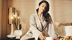 Woman, rest and coffee on hotel bed with breakfast, travel vacation or peaceful morning for wellness. Mature person, meal and relax in luxury accommodation with tea, room service food and holiday.