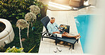 Laptop, holiday or man by swimming pool to relax, luxury travel blog or email for digital nomad. Computer, lounger or mature person on vacation with tourist article, typing review or freelancer above