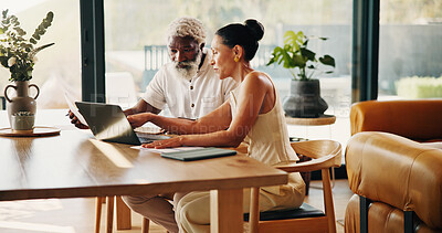 Buy stock photo Talking, finance and mature couple on laptop for mortgage, online banking and budget in home. Planning, interracial marriage and man with woman with computer, financial report and payment for bills