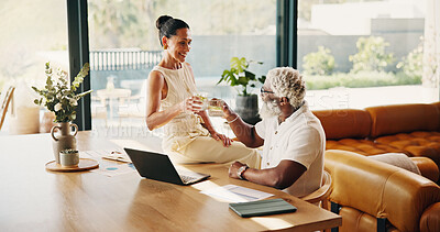 Buy stock photo Finance, couple and laptop with drink toast, 401k withdrawal or celebration for loan settlement. Happy, mature interracial people and tech with beverage cheers, credit balance and debt free in home