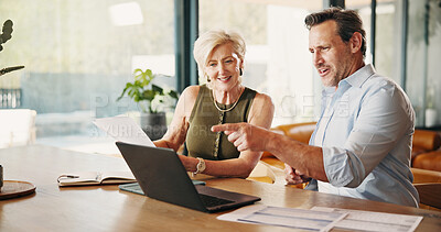 Buy stock photo Talking, paperwork and mature couple on laptop for mortgage, online banking and bills in home. Happy, marriage and man with woman with computer, finance report and asset management for savings budget