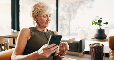Buy stock photo Phone, home and mature woman with credit card, online shopping and purchase for website sale. Ecommerce, sofa and person on cellphone for banking app, transaction and payment for digital subscription