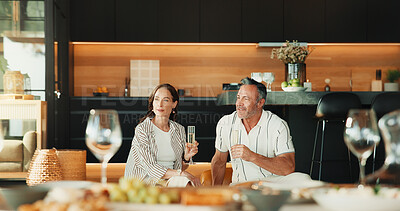 Buy stock photo Couple, home and smile with champagne, relax and bonding with partner in lounge or thinking together. Relationship, anniversary and happy mature people with alcohol, reflection and love in house