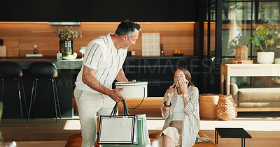 Buy stock photo Love, couple and surprise gift in home, drink champagne or gratitude for anniversary celebration. Happy man, mature woman or shock with present, beverage or wow for marriage milestone with partner