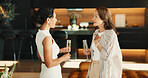 Friends, relax and conversation in living room with champagne, gossip or bonding together on weekend. Mature women, hangout and discussion in home with alcohol drink, connection and stress relief.