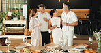 Celebration, hug or friends in home with champagne, bonding or happy moment with reunion meal. Smile, drink or mature people with dinner together, party connection or good time with social gathering.