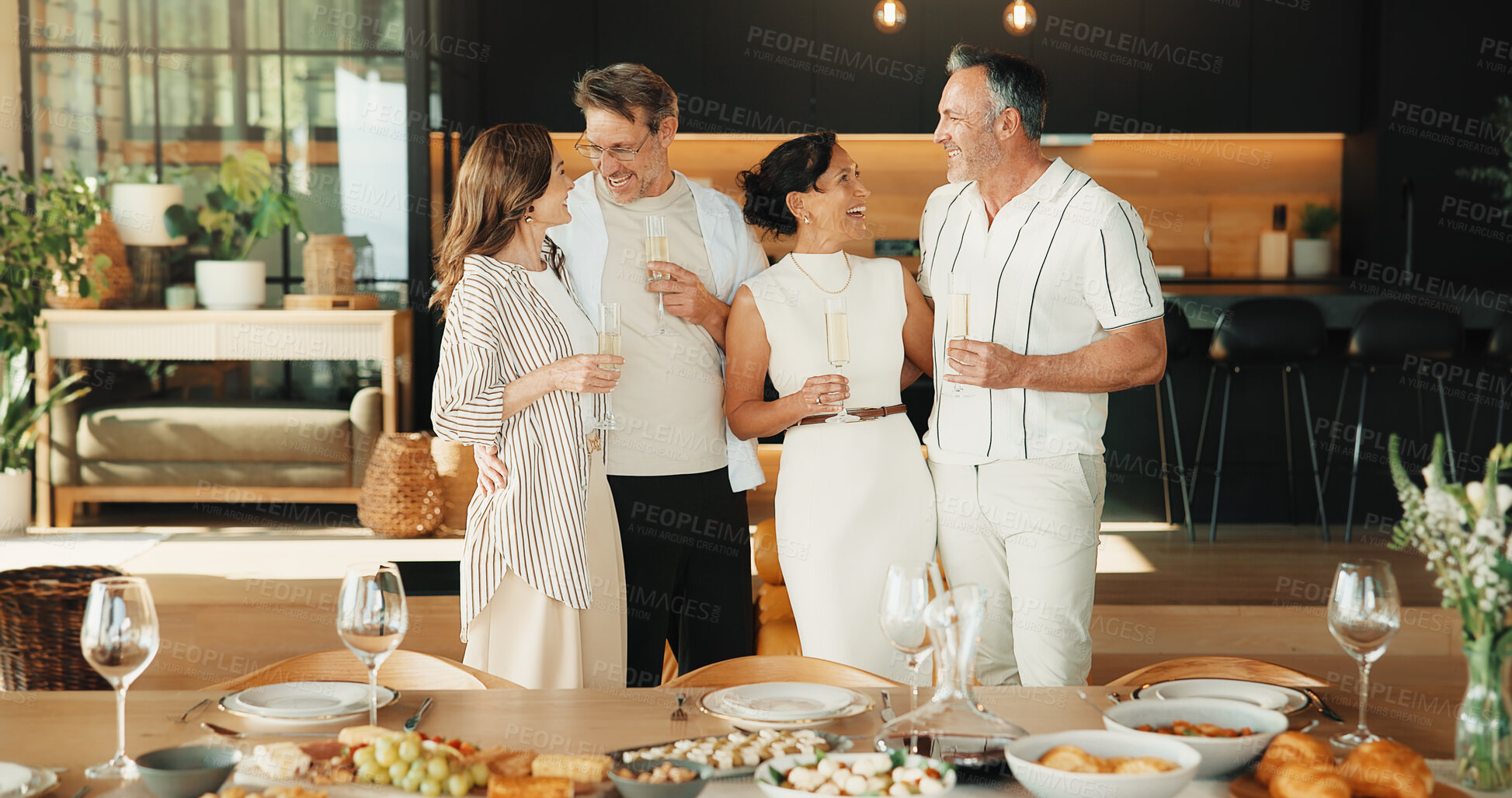 Buy stock photo Celebration, hug or friends in home with champagne, bonding or happy moment with reunion meal. Smile, drink or mature people with dinner together, party connection or good time with social gathering.