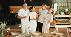 Celebration, hug or friends in house with champagne, bonding or happy moment with reunion meal. Laugh, drink or mature people with dinner together, party connection or good time with social gathering