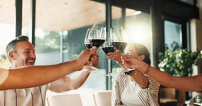 Buy stock photo Friends, red wine and together for toast in house for celebration, social gathering or reunion. Mature men, women and happy with alcohol drinks in home for cheers, support and holiday with group