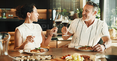 Buy stock photo Couple, food or toast with wine for love, relationship milestone or anniversary meal in home. Happy man, mature woman and cheers with drink for appreciation, marriage care and lunch date with alcohol
