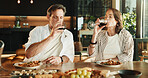 Couple, food and drinking in home with wine, relationship milestone and anniversary meal at table. Woman, mature man and relax with alcohol, marriage bonding and lunch date with connection in house