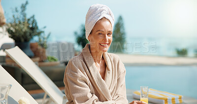 Buy stock photo Smile, woman and relax at resort with drink, travel and summer holiday for weekend unwind. Portrait, mature person or orange juice at retreat with sunshine, calm morning and stress relief on vacation