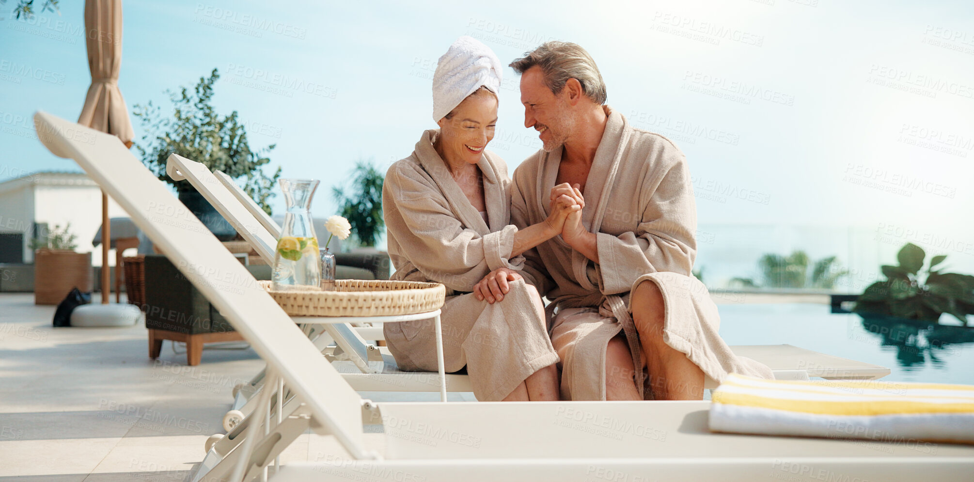 Buy stock photo Couple, relax and holding hands at resort for travel, love and bonding together on summer holiday. Space, mature people and smile at retreat with romance, partner affection and fresh air on vacation