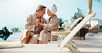 Couple, relax and holding hands at resort with smile, love and bonding together on summer holiday. Space, mature people and happy at retreat with romance, partner affection and fresh air on vacation