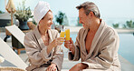 Relax, cheers and happy couple with drink for vacation, holiday getaway or date in luxury resort. Man, woman and toast with smile by swimming pool for weekend getaway or accommodation in beauty spa