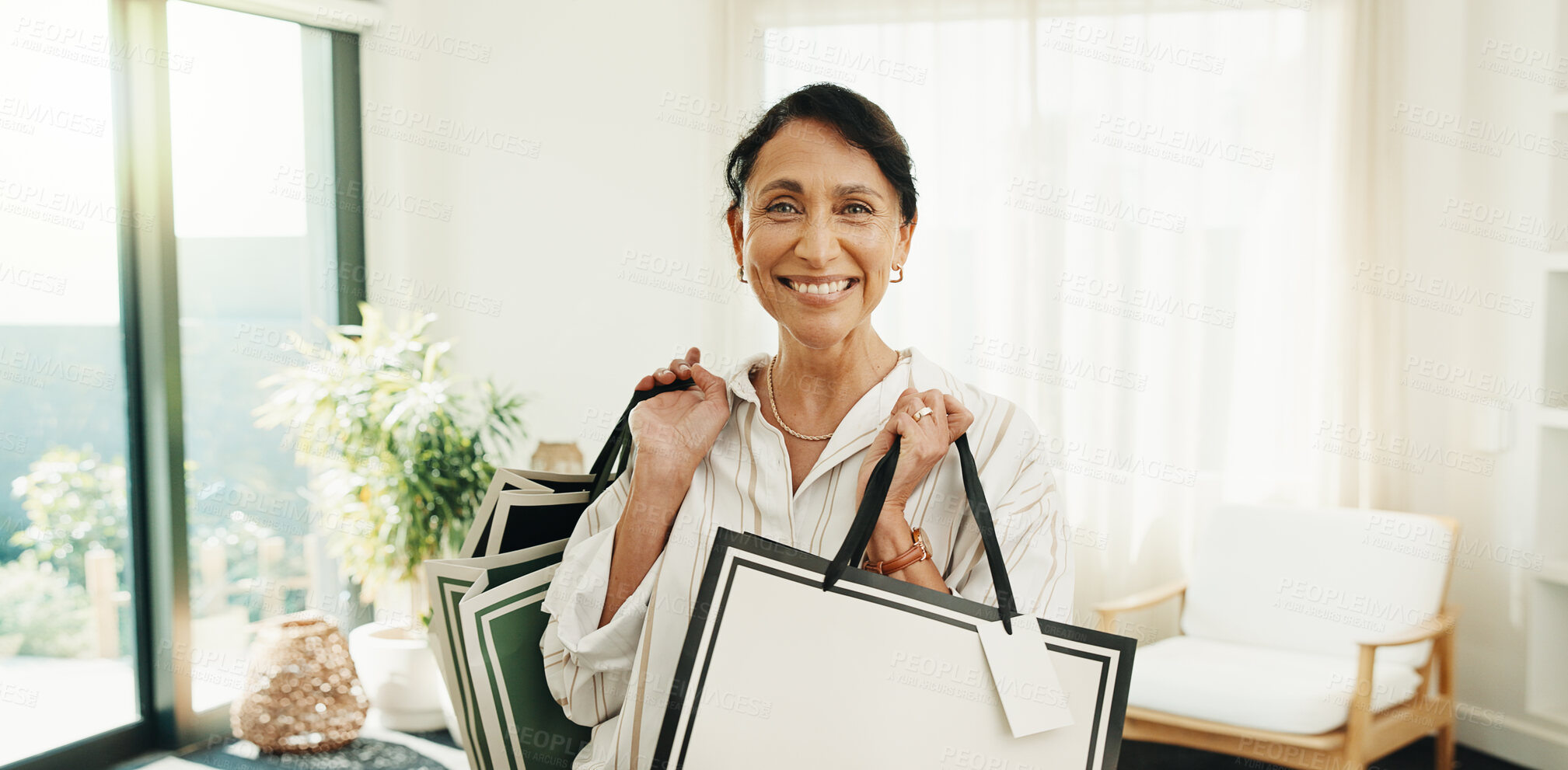 Buy stock photo Portrait, woman and shopping bag at house for fashion, clothing haul and purchase for retail spree. Smile, mature person and package in home with new outfit, bargain and discount for wardrobe restock