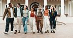Friends, students and walk at university with smile, exchange program and scholarship for education. Happy, people and study group at campus with backpack, start semester and learning for knowledge
