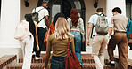Back, girl and walk at college for education degree, semester start and ready for masters course. Mission, student or people on stairs for campus first day, university arrival or new academic journey