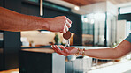 Hands, key and landlord in new house with tenant, property investment or rental agreement with owner. People, keychain handover and moving in apartment with housing agent, relocation and real estate.
