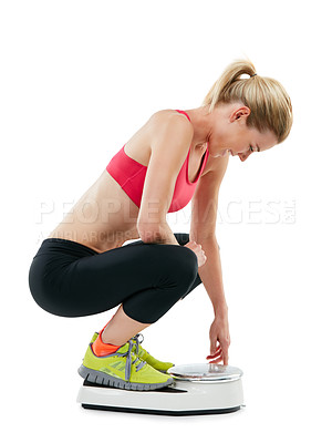 Buy stock photo Weight, scale and woman in studio with fitness goals, self care and target for exercise. Weightloss, model and happy athlete with wellness for training, cardio results and smile on white background