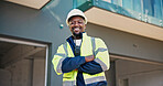 Portrait, man and supervisor at construction site with arms crossed, smile and engineering expertise. Happy, engineer or black person outdoor with confidence, experience or PPE for renovation project
