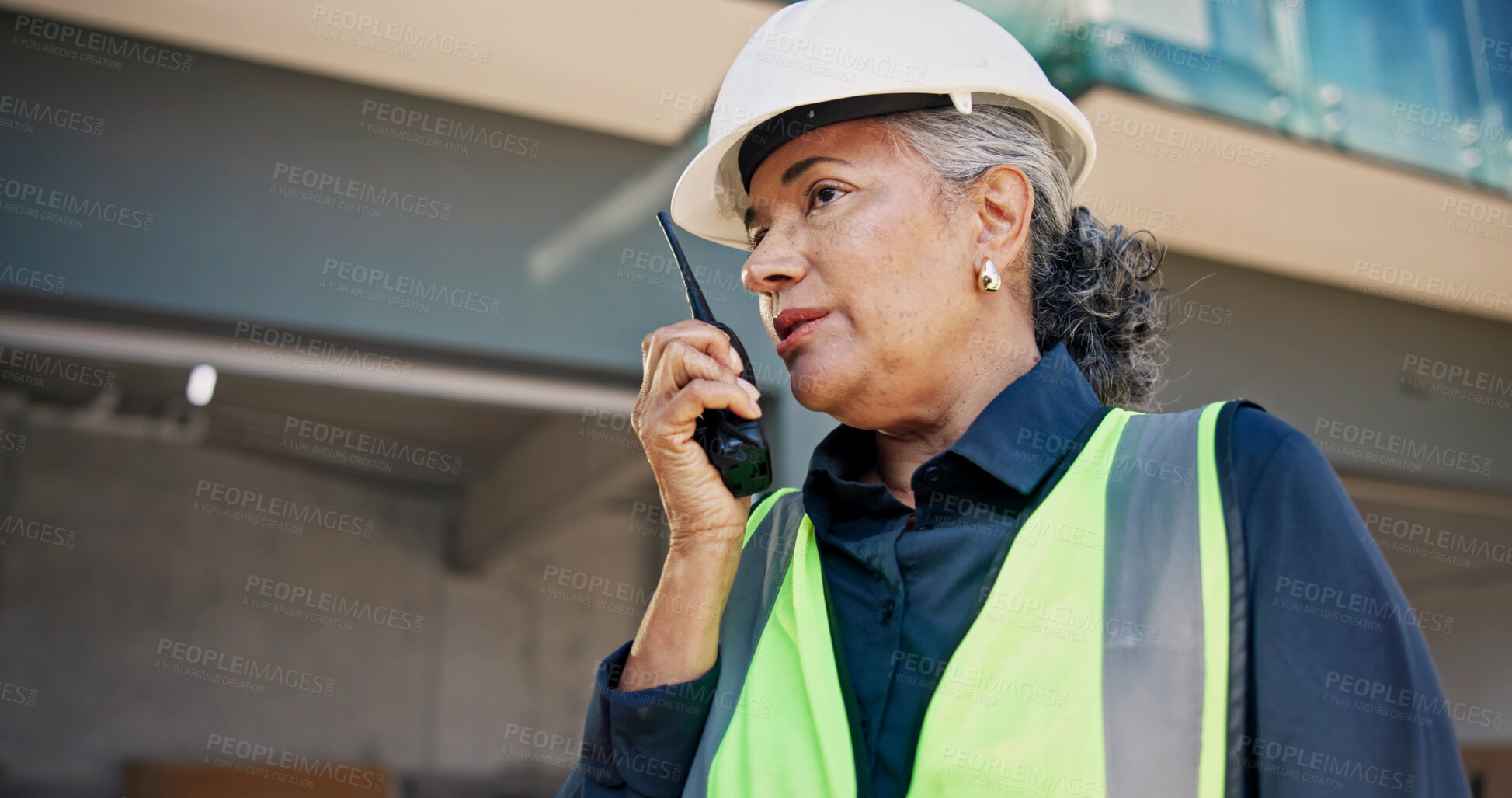 Buy stock photo Engineer, radio and woman with talk on construction site for inspection, planning or renovation. Surveyor, communication and mature person for property development, building project or remodeling