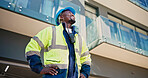 Technician, man and thinking by building with smile, safety helmet and vision for remodeling project. Low angle, happy electrician and black person outdoor with property development, idea and plan.