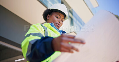 Buy stock photo Engineer, reading and woman with blueprint, outdoor and planning for property development or design. Civil engineering, low angle and black person with paperwork, architecture and renovation project