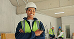 Portrait, engineer and happy woman at construction site with arms crossed, radio and PPE for safety. Confident, person or engineering supervisor in building with tech, expertise or helmet for project