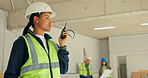 Supervisor, woman and talk at construction site with radio, update and coordination for engineering. Civil engineer, person and communication in building with tech, instructions or project management