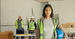 Serious, electrician and woman with helmet on construction site, safety and pride for career growth. Maintenance, team and people with hard hat for protection, portrait and technician in building