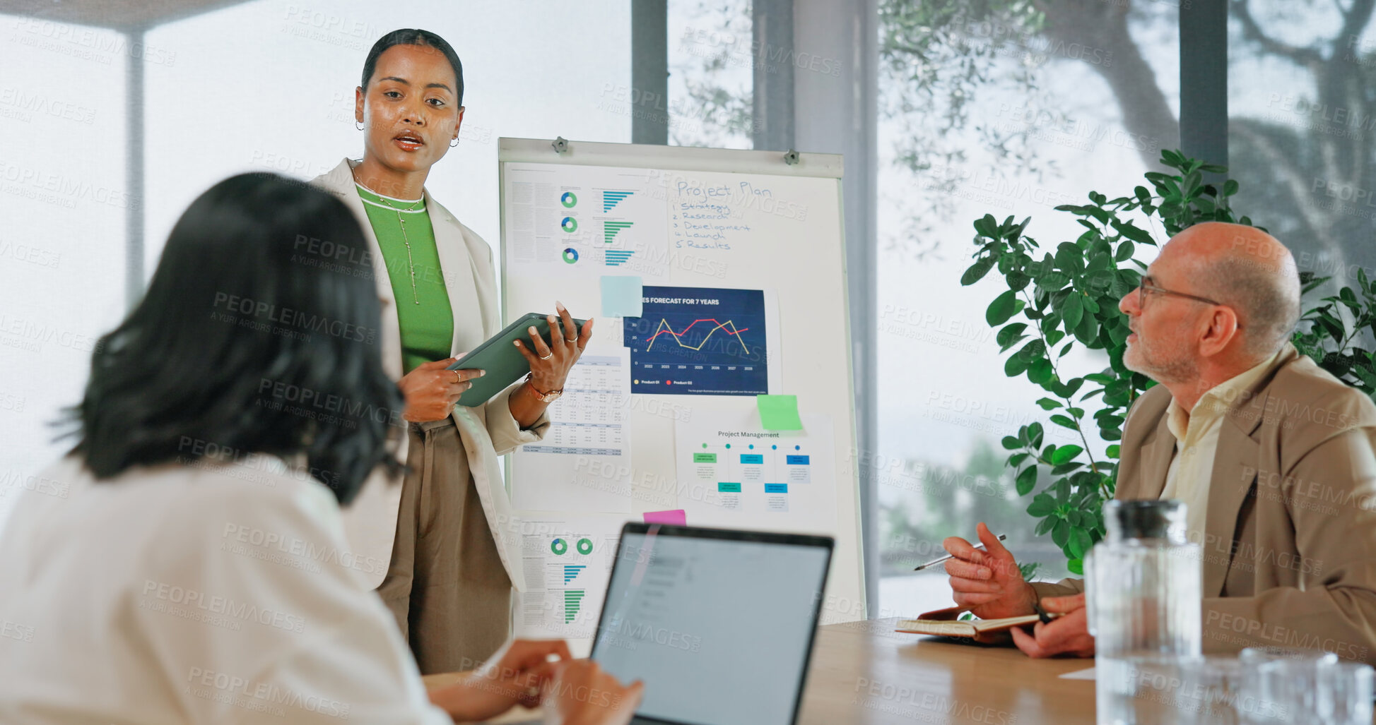 Buy stock photo Woman, presentation or meeting with tablet for business analytics or team performance review. `Person, speaker or discussion with technology, graph or statistics for project budget in workplace