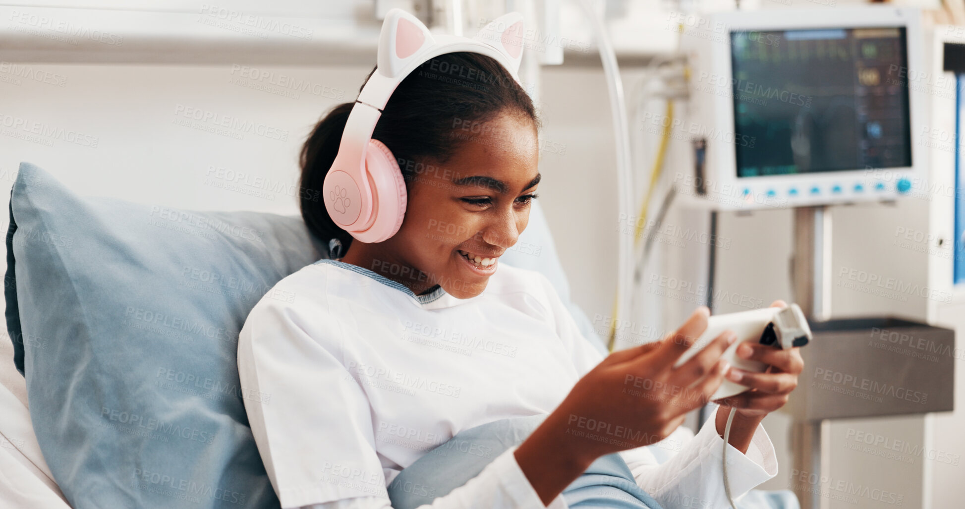 Buy stock photo Phone, headphones and kid in hospital bed with music, play online game and surgery recovery. Happy patient, mobile and girl with audio in pediatric ward for gaming, watch video or rest for healthcare