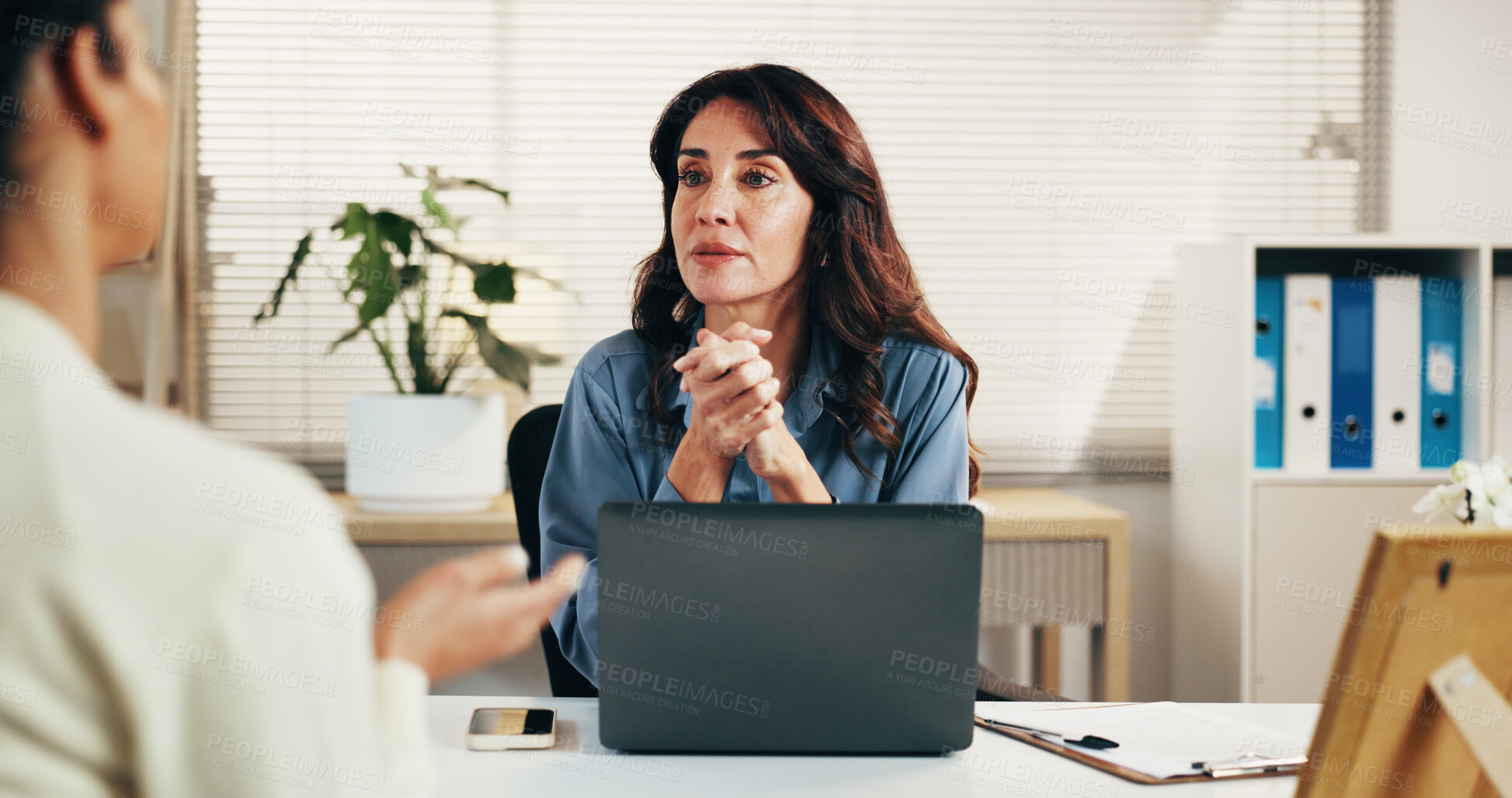 Buy stock photo Laptop, woman and consultation in office with client for insurance, risk assessment or listening. Computer, talking and mature advisor in meeting with person for policy, financial coverage and quote