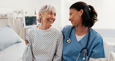 Buy stock photo Happy, nurse and old woman on hospital bed with hug, support and good news for recovery from disease. Healthcare worker, senior person and embrace in clinic with smile, help and healing from illness.