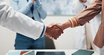 Doctor, people and meeting with handshake for medical funding, partnership or merger in hospital. Medical team, employees or shaking hands with agreement for healthcare finance, deal or development