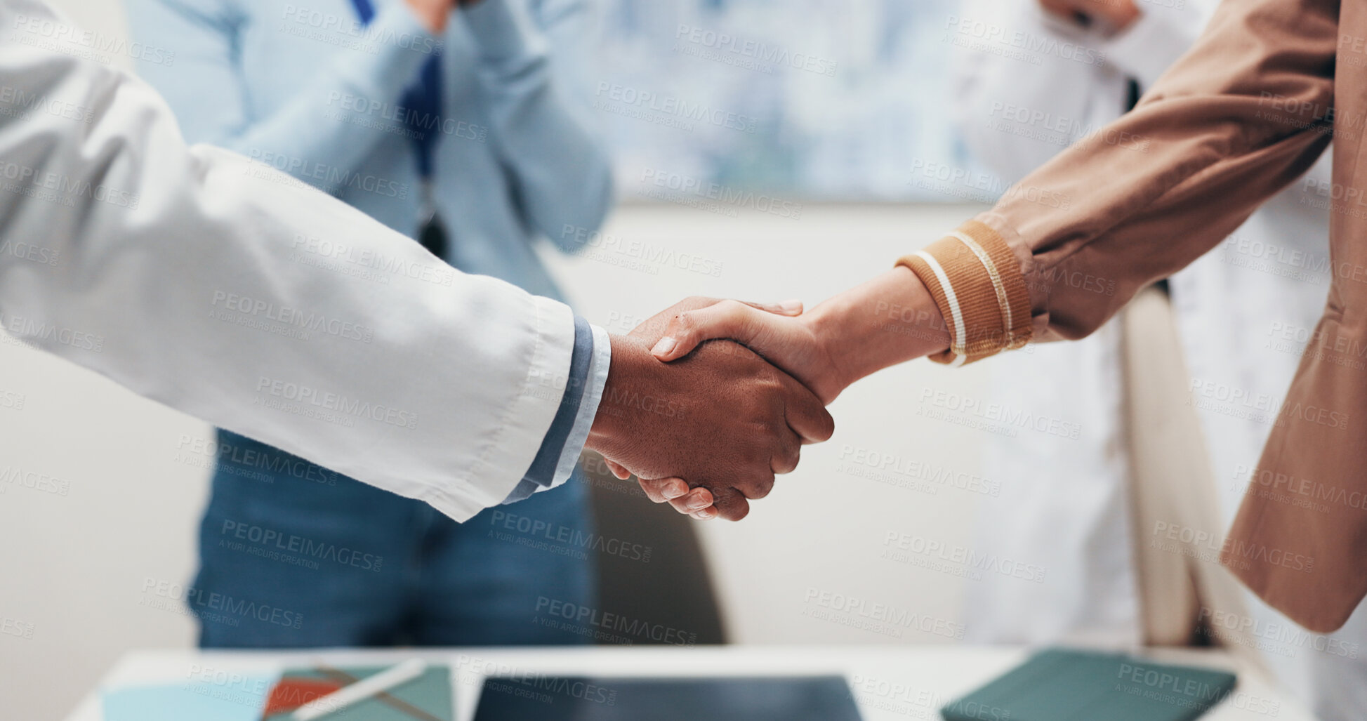 Buy stock photo Doctor, people and meeting with handshake for medical funding, partnership or merger in hospital. Medical team, employees or shaking hands with agreement for healthcare finance, deal or development