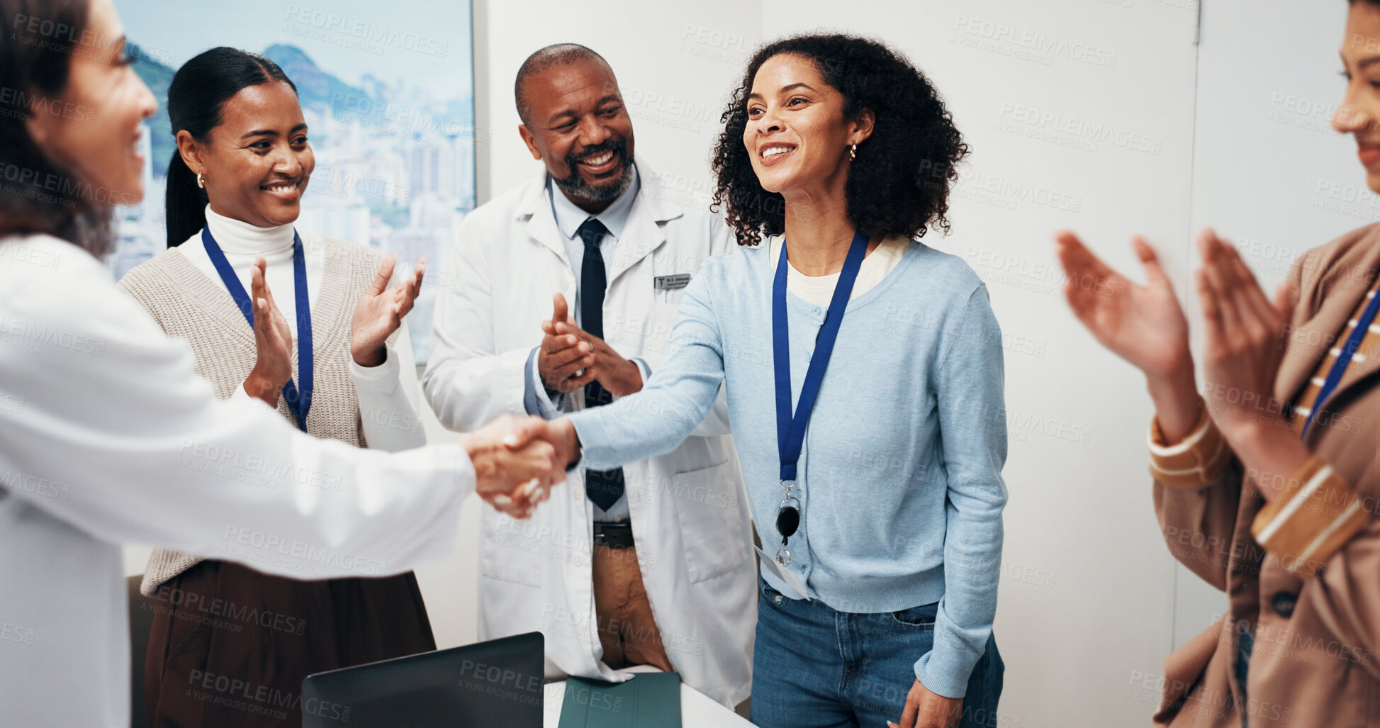 Buy stock photo Doctor, people and meeting with handshake for winning, team success or promotion in hospital. Happy, woman and shaking hands with healthcare workers or applause for congratulations in clinic seminar