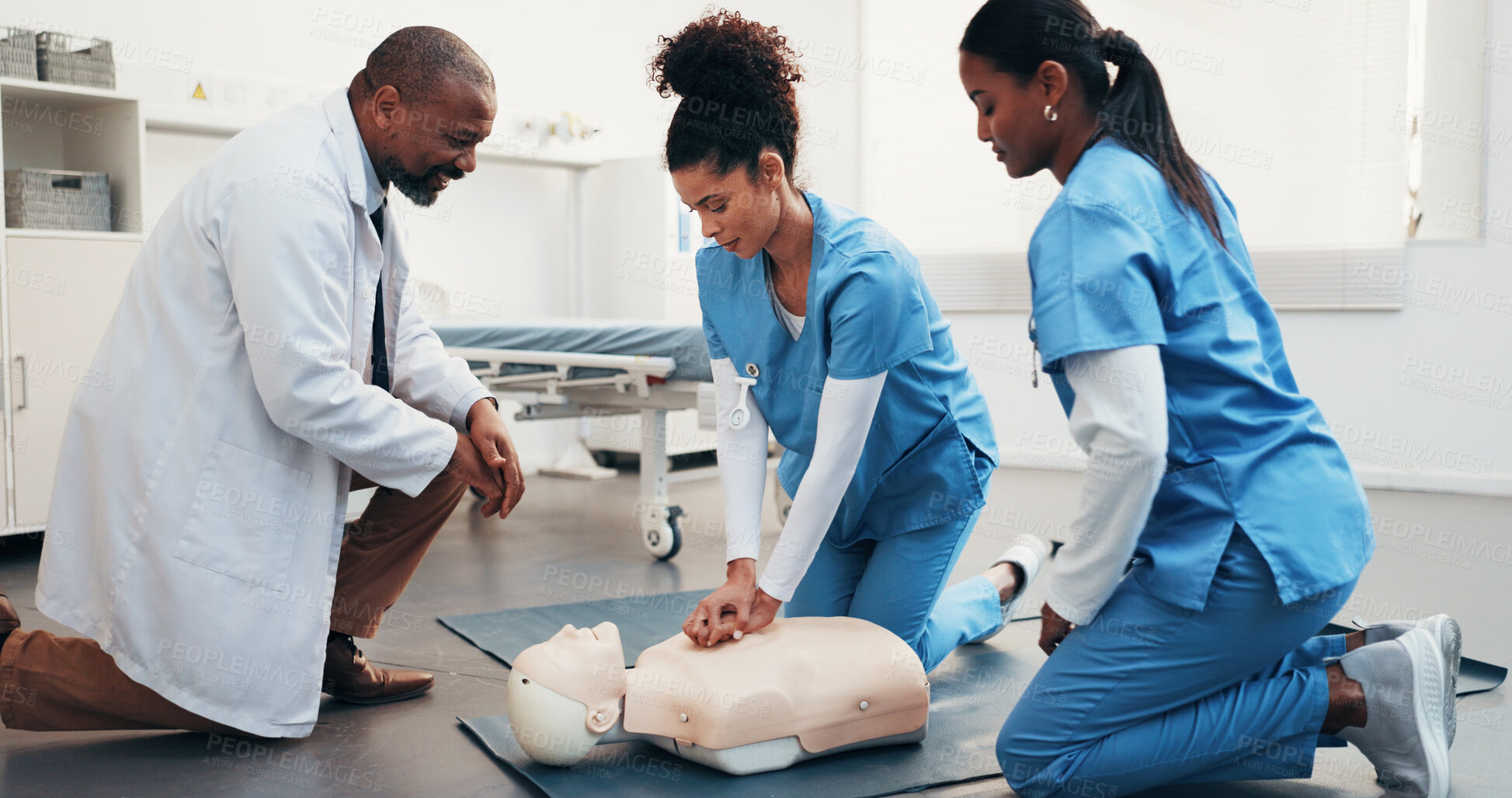 Buy stock photo Medical, team and mannequin in clinic for cpr training, chest compression and technique in nursing. People, physician and nurses with dummy for life saving procedure, clinical simulation or education