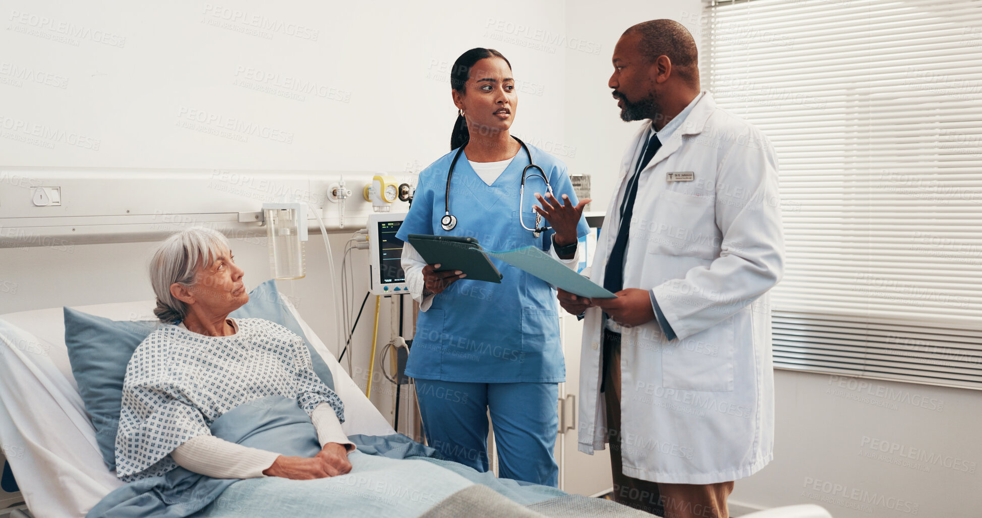 Buy stock photo Hospital bed, medical team and discussion with senior woman, folder or tablet for recovery update. Tech, doctor and nurse with elderly patient in ward for checkup, care plan or healthcare report