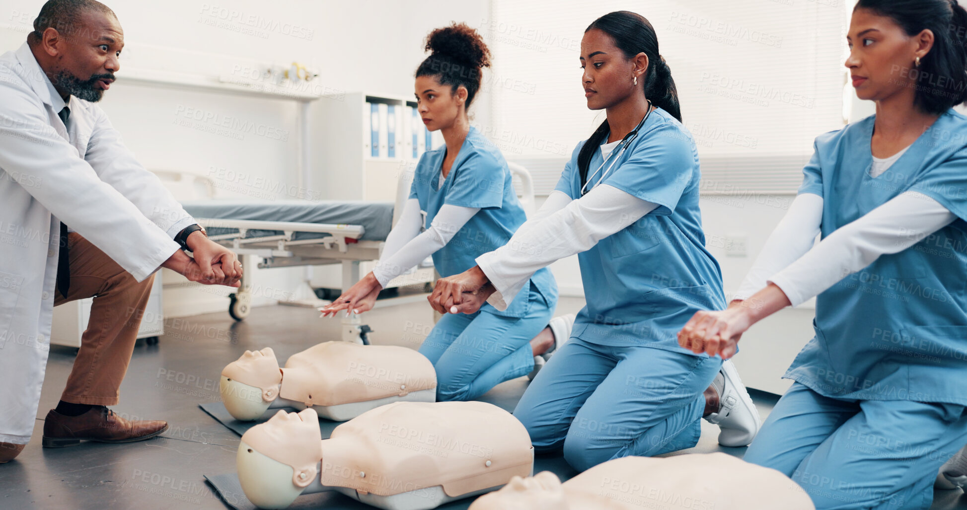 Buy stock photo Health, team and mannequin in training for cpr, compression technique and residency practical. Man, physician and resident doctors with dummy, first aid demonstration or simulation for cardiac arrest