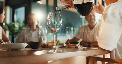 Buy stock photo Lunch, people and pour red wine in home with decanter, bonding together or food for social gathering. Friends, meal and alcohol drink on dining table with glass, weekend hangout and reunion in house.