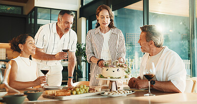 Buy stock photo Mature, people and wine glass with birthday cake in home for celebration, event or social gathering. Group, dessert or couple of friends bonding with drink for get together, reunion or party in house