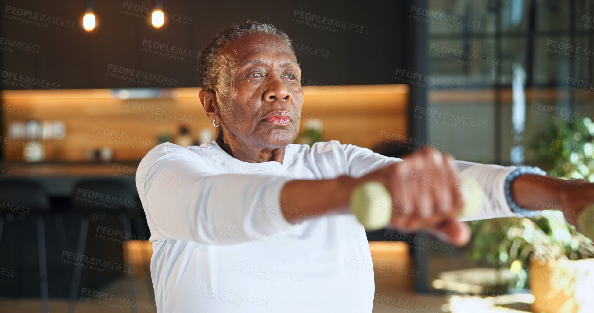Buy stock photo Workout, dumbbells and elderly woman in home for muscle growth, osteoporosis prevention or health. Weightlifting, black person and raises for wellness, strength development or retirement fitness