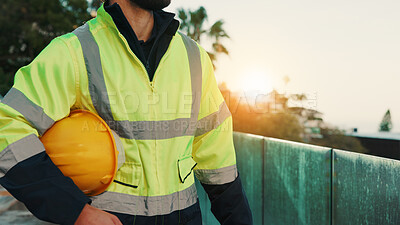 Buy stock photo Man, hands and builder outdoor with helmet, accident prevention and safety compliance for renovation. Construction worker, person and hard hat on balcony for building site protection, rules and PPE.