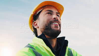 Buy stock photo Construction worker, thinking and happy man with helmet, outdoor and pride for property development. Sky, mockup space and person with hardhat for safety, low angle and idea for renovation project