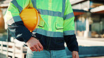 Man, hands and builder with helmet for home renovation, injury prevention or safety rule for project. Construction worker, person and hard hat outdoor with reflector jacket, PPE and industrial job.