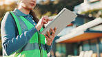 Construction worker, scroll and hands with tablet, outdoor or research for renovation project on app. Property development, information and person with technology, low angle and browsing on website